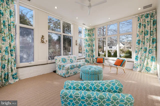a kitchen with stainless steel appliances a stove a sink and white cabinets