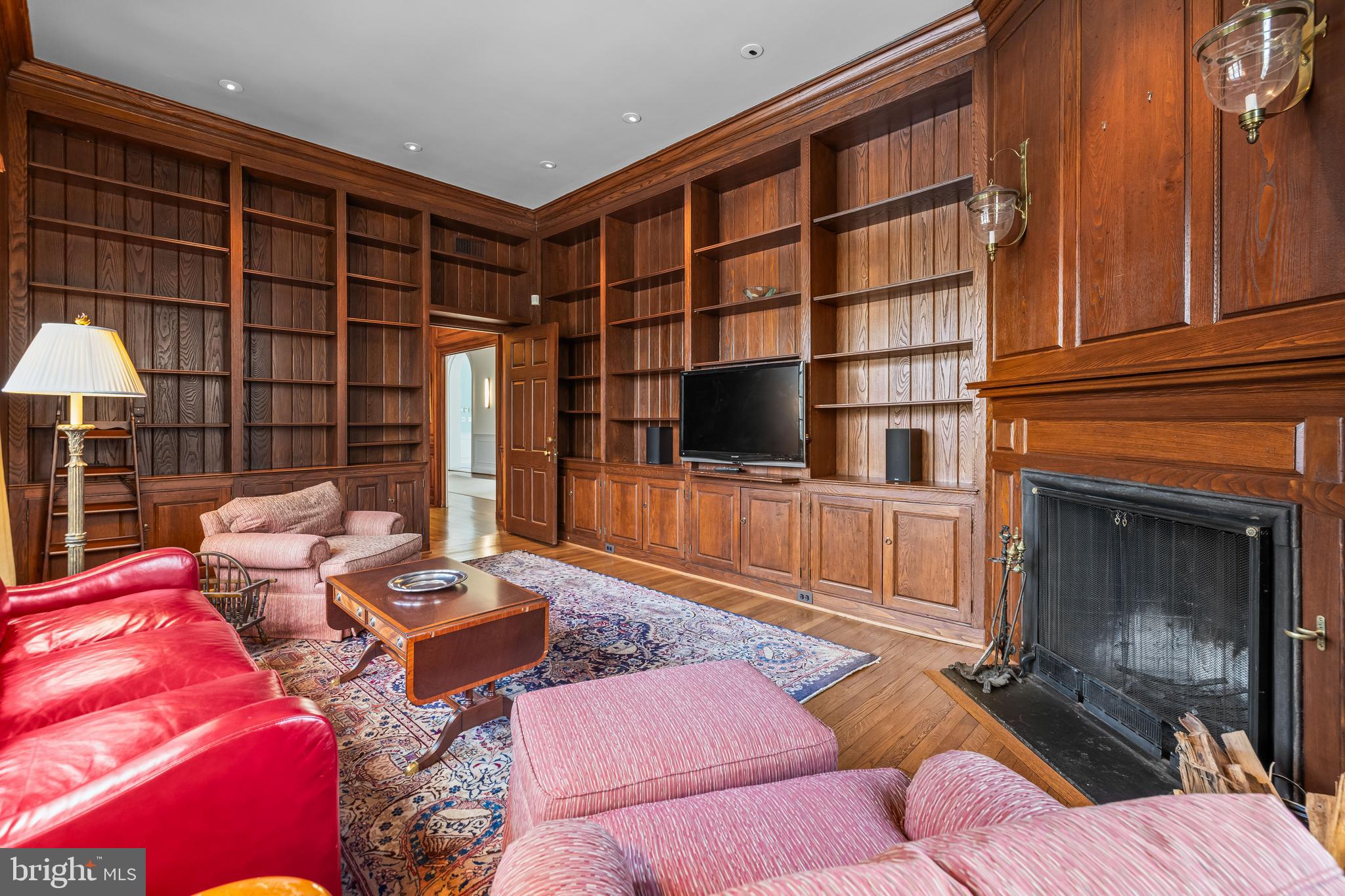 20 Blythewood Road Baltimore, MD 21210 - Photo 18 of 95 a living room with furniture a flat screen tv and a fireplace