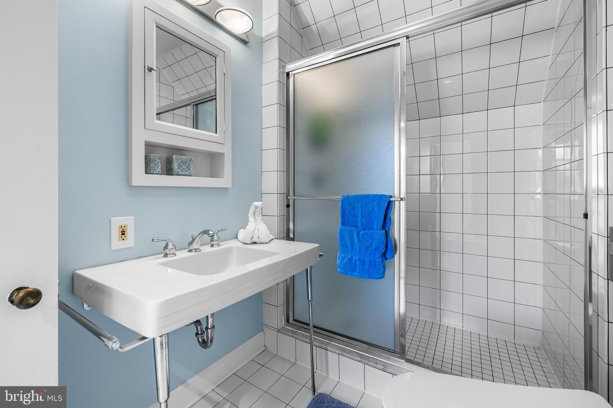 20 Blythewood Road Baltimore, MD 21210 - Photo 64 of 95 a bathroom with a sink mirror and vanity