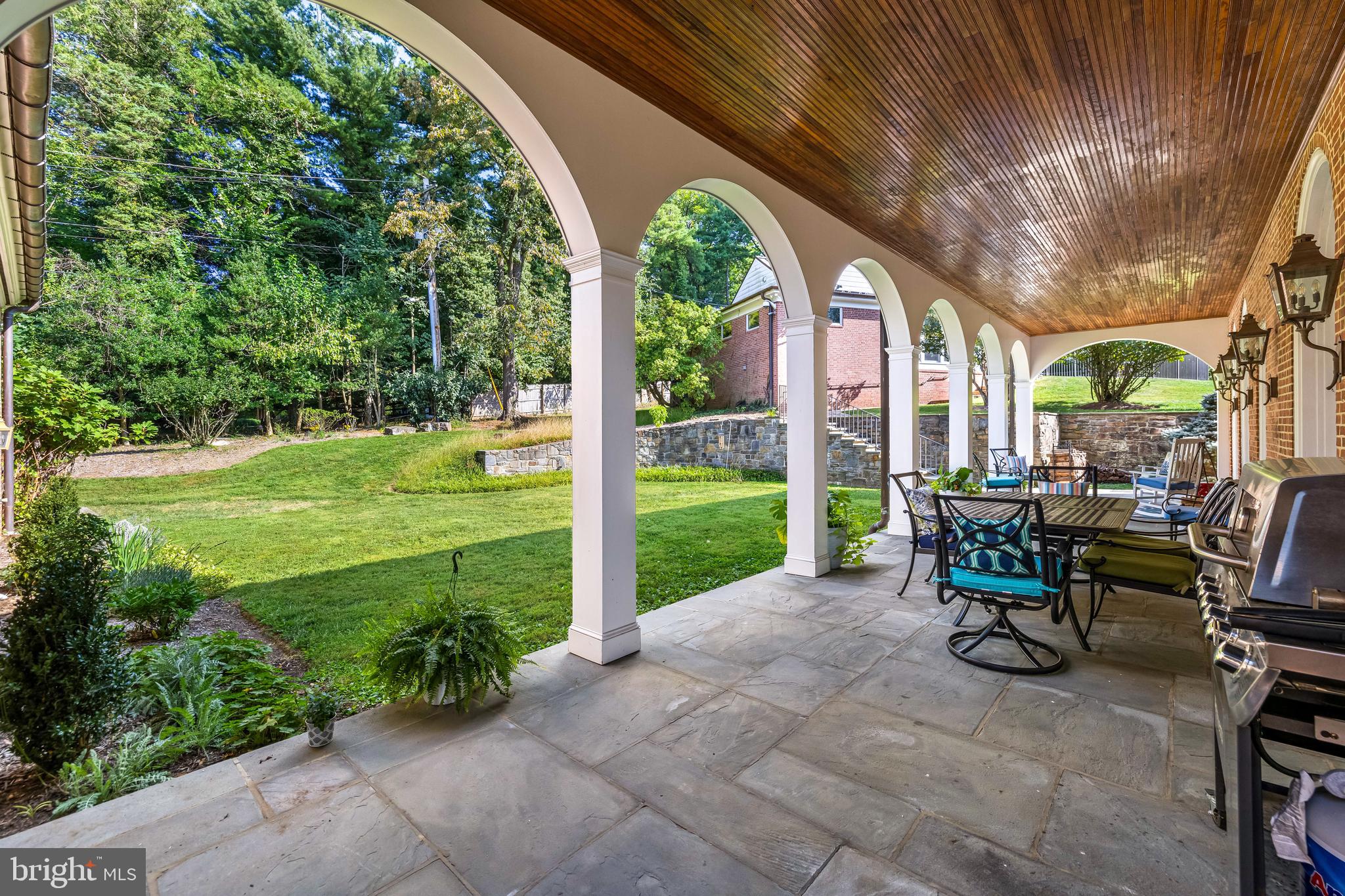 20 Blythewood Road Baltimore, MD 21210 - Photo 85 of 95 a view of a patio with table and chairs plants and large trees