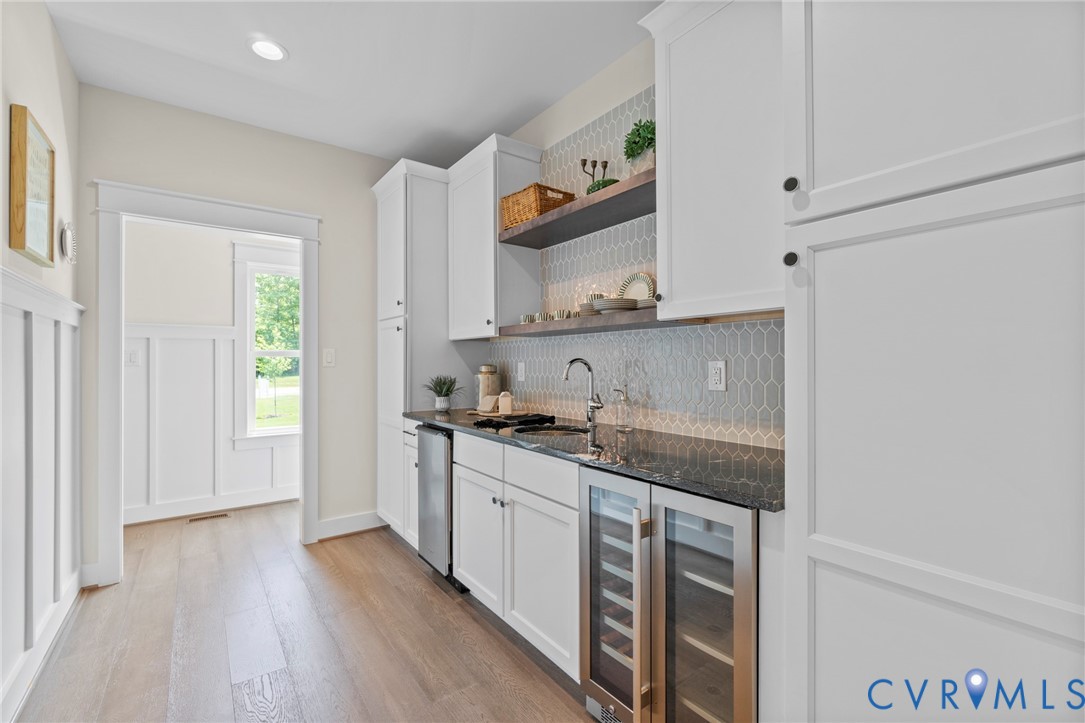 3076 Braehead Road Powhatan, VA 23139 - Photo 15 of 41 a kitchen with stainless steel appliances granite countertop a stove a sink and a microwave