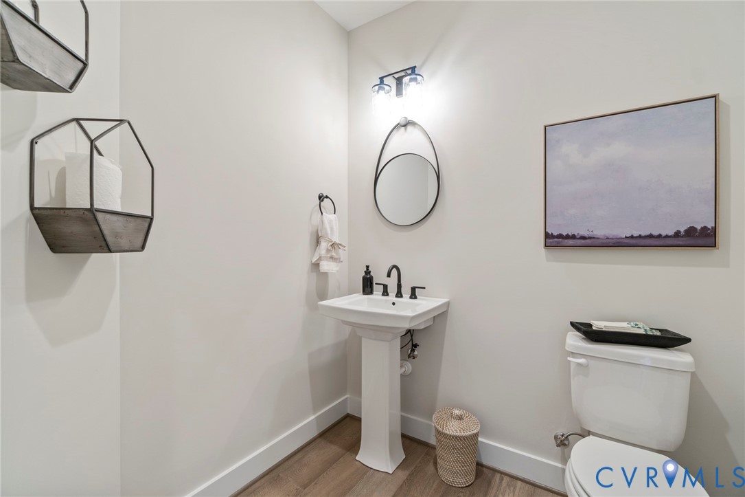 3076 Braehead Road Powhatan, VA 23139 - Photo 17 of 41 a bathroom with a toilet a sink and mirror