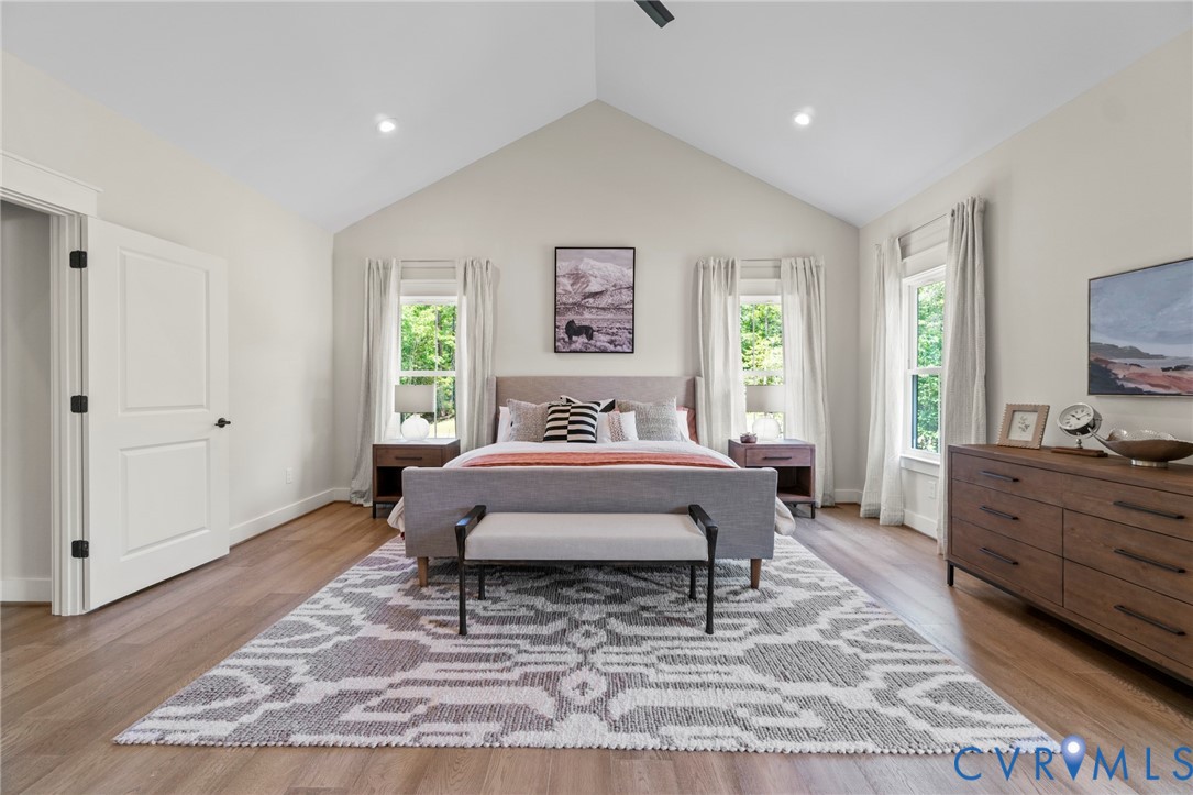 3076 Braehead Road Powhatan, VA 23139 - Photo 19 of 41 a spacious bedroom with a bed a window and dresser