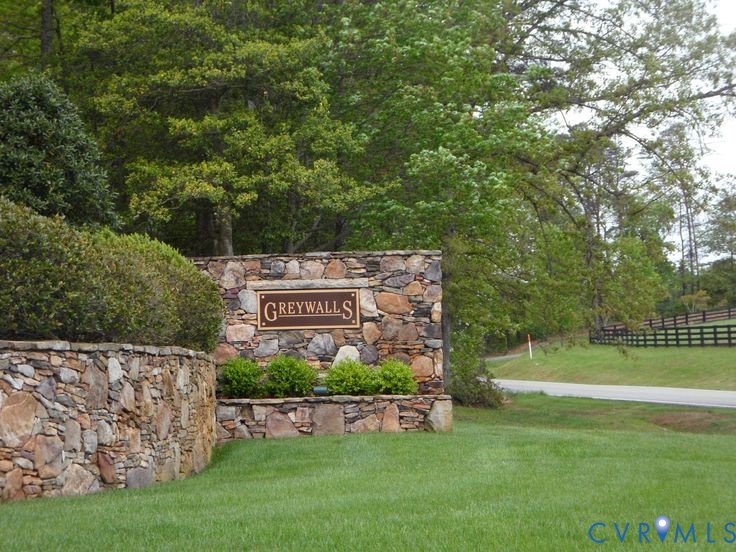 3076 Braehead Road Powhatan, VA 23139 - Photo 37 of 41 a sign that is sitting on a lush green field
