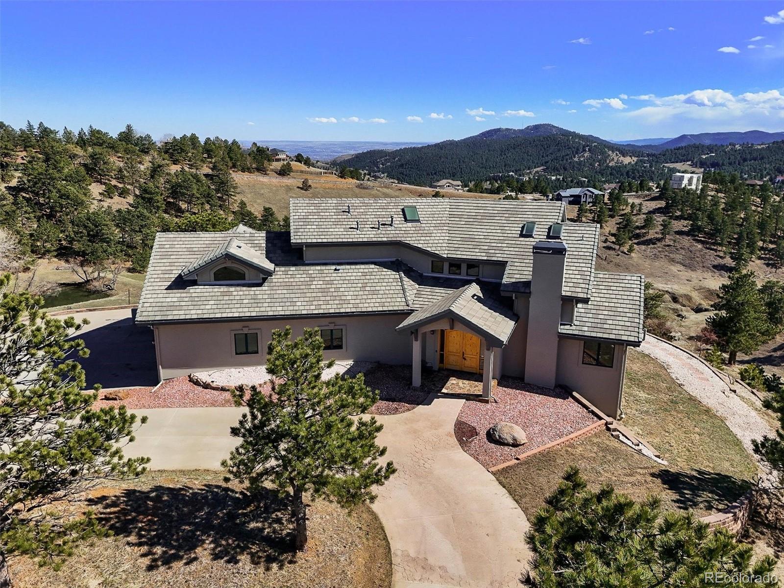 156 South Lookout Mountain Road Golden, CO 80401 - Photo 1 of 50 a view of a terrace with a garden and mountain view