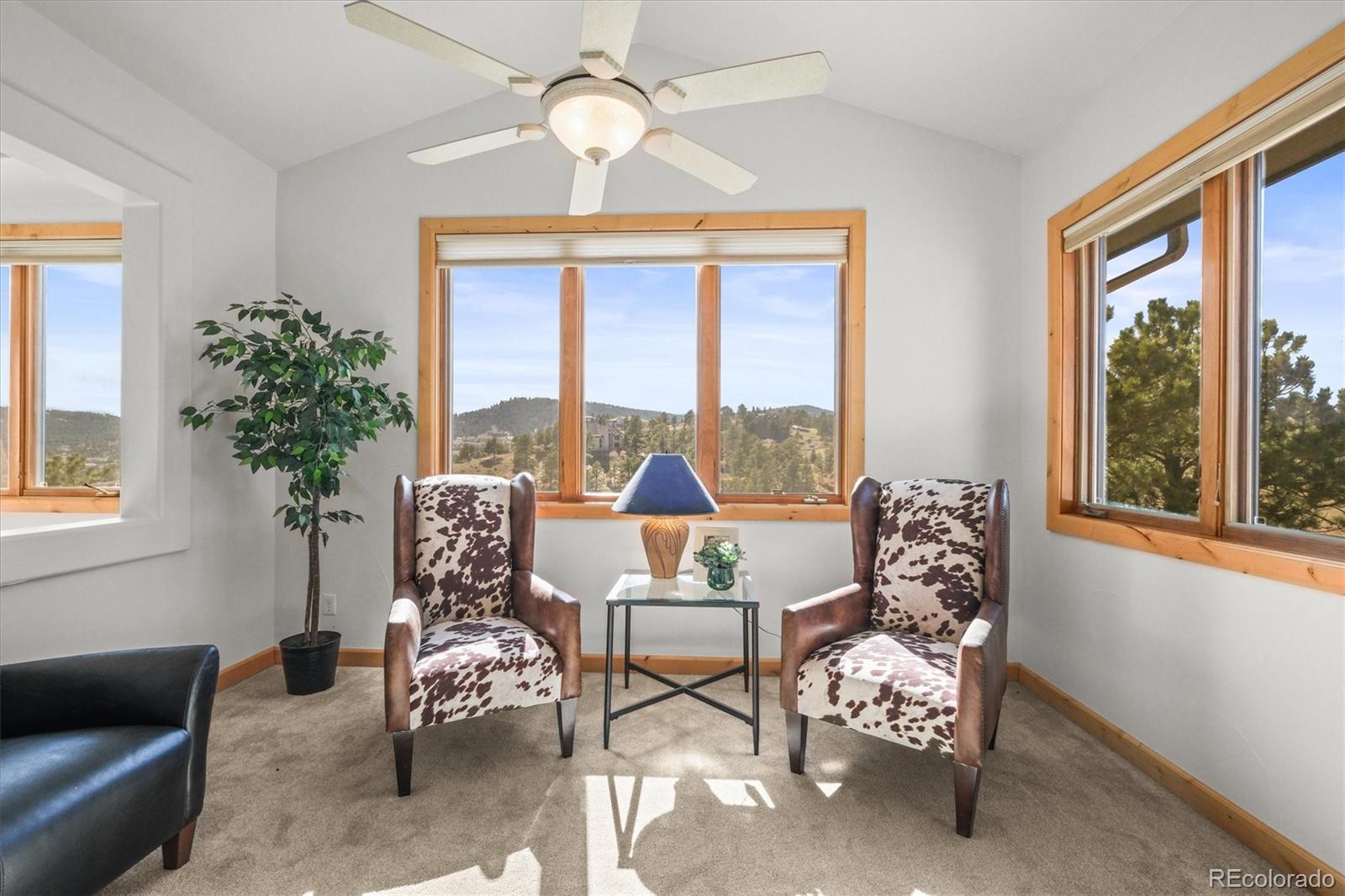156 South Lookout Mountain Road Golden, CO 80401 - Photo 11 of 50 a living room with furniture and a large window