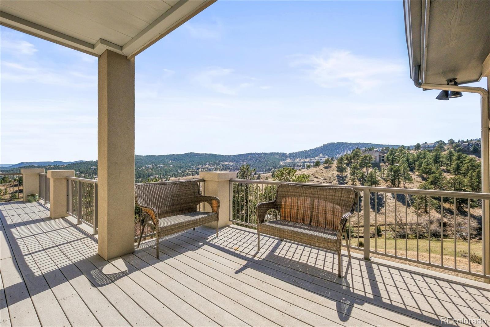 156 South Lookout Mountain Road Golden, CO 80401 - Photo 16 of 50 a view of a balcony with wooden floor next to a lake