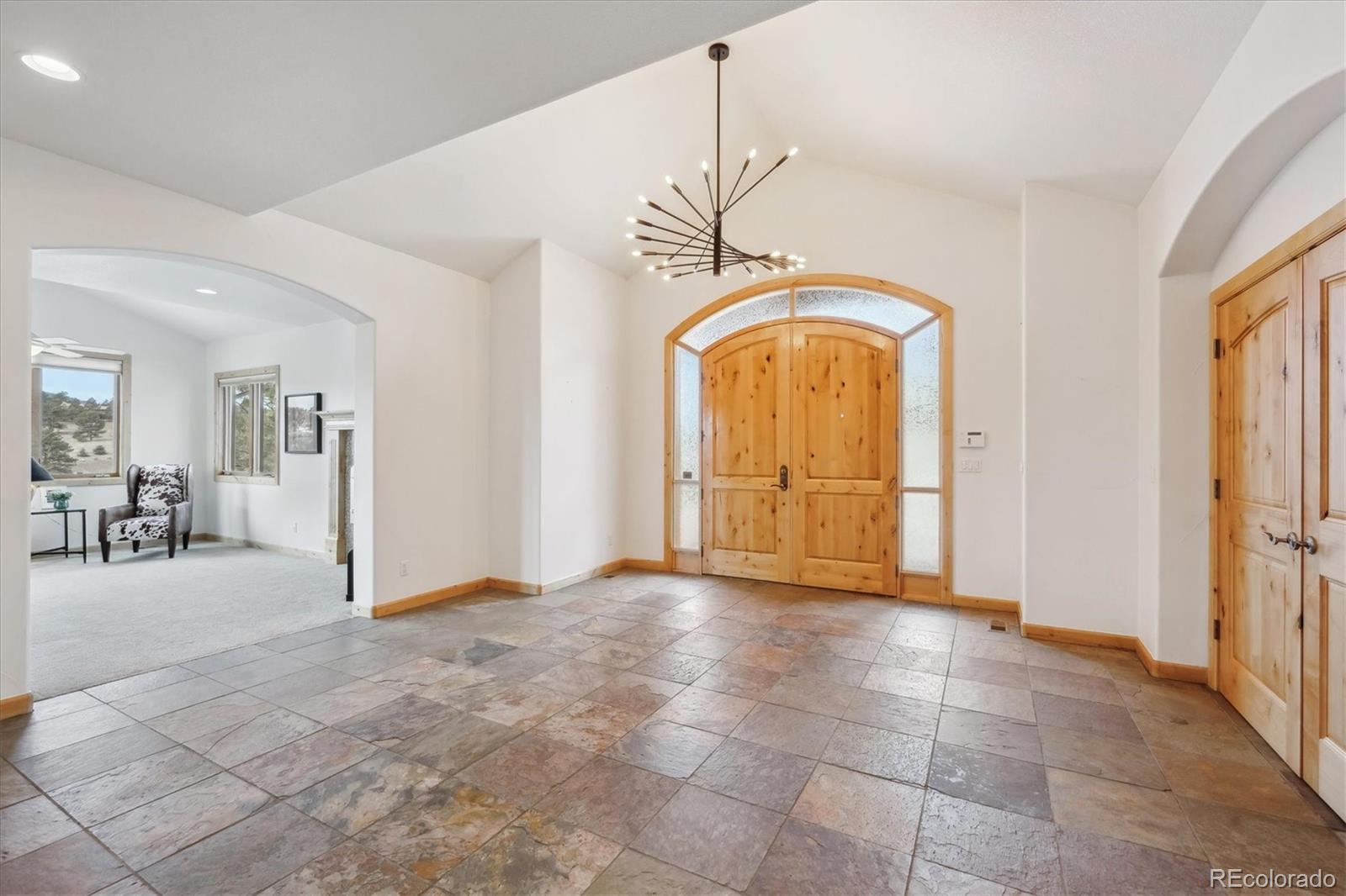 156 South Lookout Mountain Road Golden, CO 80401 - Photo 24 of 50 a view of a livingroom with a staircase