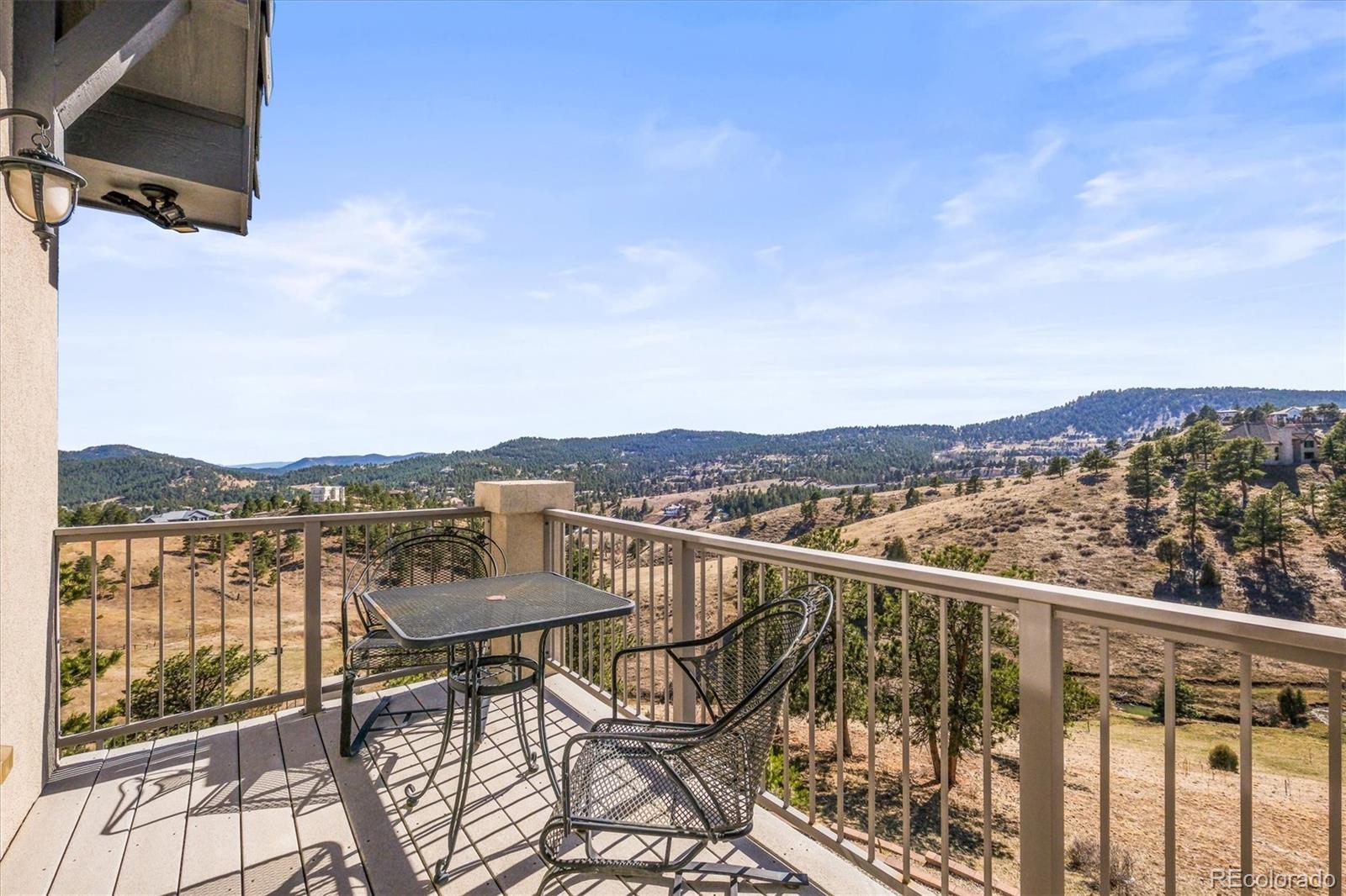 156 South Lookout Mountain Road Golden, CO 80401 - Photo 27 of 50 a view of a city from a balcony with furniture