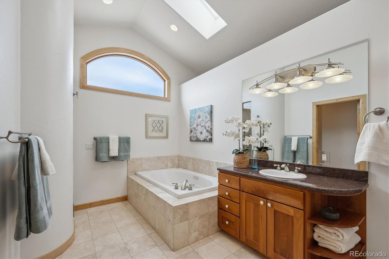 156 South Lookout Mountain Road Golden, CO 80401 - Photo 29 of 50 a bathroom with a double vanity sink and a mirror