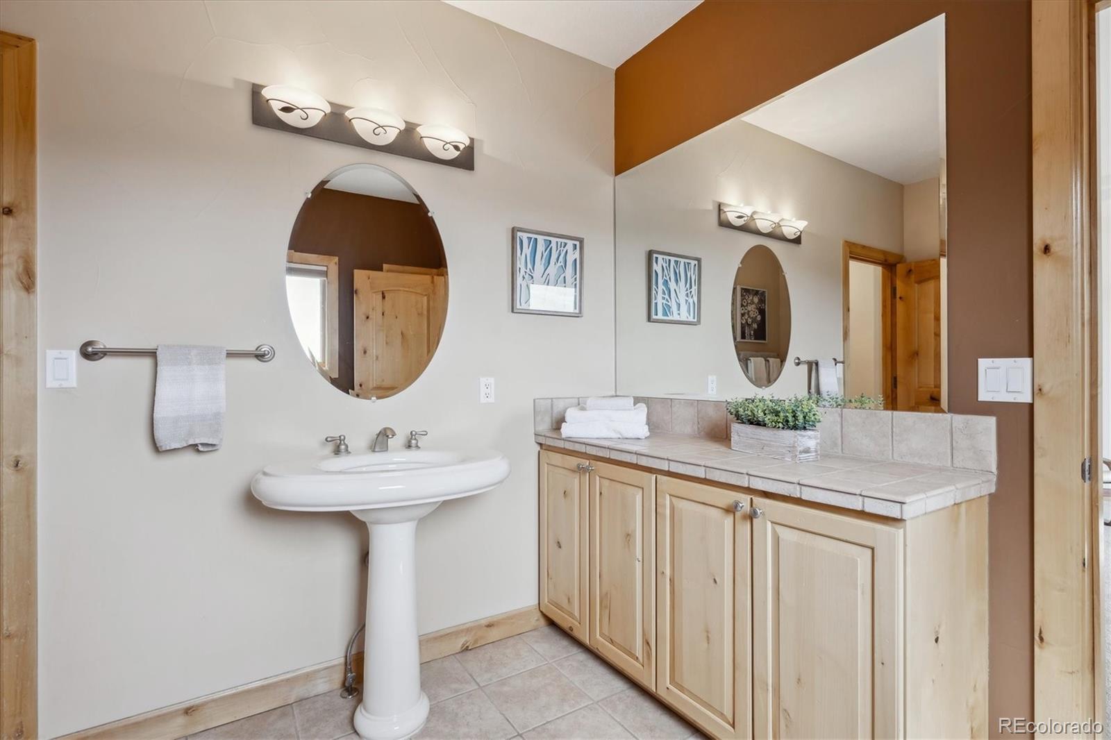 156 South Lookout Mountain Road Golden, CO 80401 - Photo 37 of 50 a bathroom with a sink and a mirror