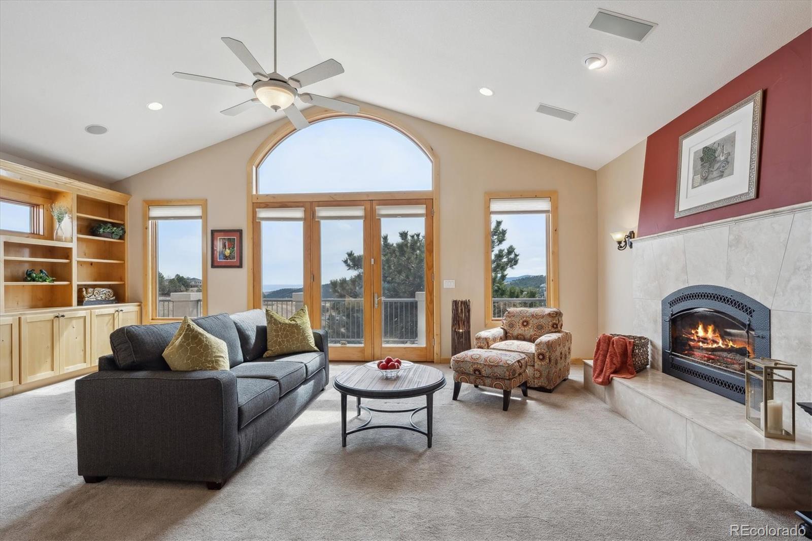 156 South Lookout Mountain Road Golden, CO 80401 - Photo 7 of 50 a living room with furniture and a fireplace