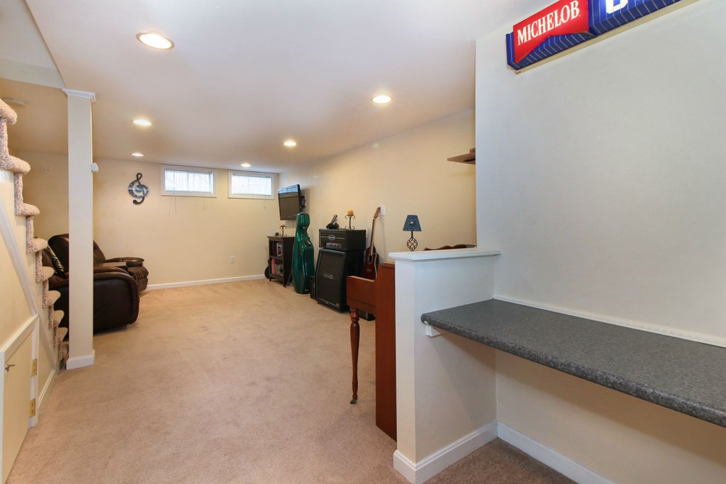 90 Roper Street, Unit D Lowell, MA 01852 - Photo 14 of 17 a view of a room with gym equipment