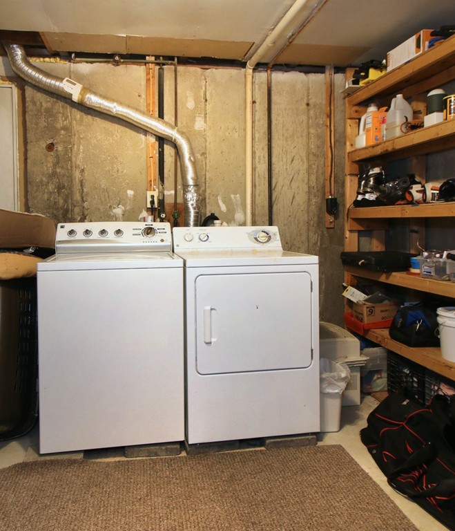 90 Roper Street, Unit D Lowell, MA 01852 - Photo 16 of 17 a utility room with dryer and washer