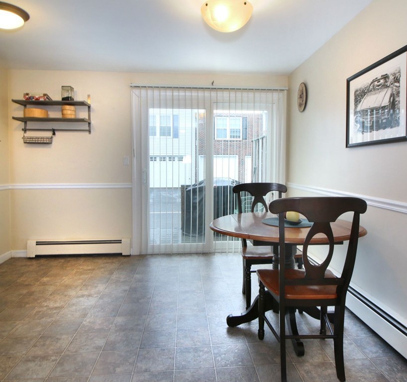 90 Roper Street, Unit D Lowell, MA 01852 - Photo 5 of 17 a view of a dining room with furniture