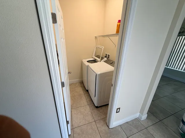 a view of a storage and utility room with a sink