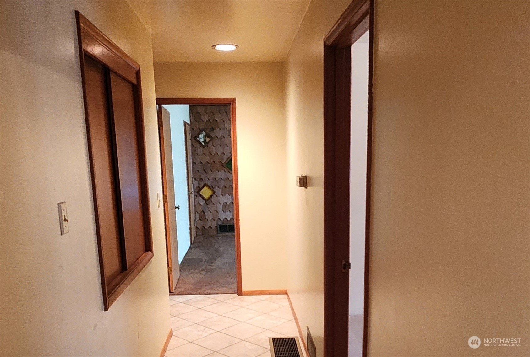976 Ocean Beach Road Hoquiam, WA 98550 - Photo 17 of 34 a view of a hallway with wooden shelves