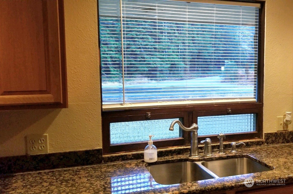 976 Ocean Beach Road Hoquiam, WA 98550 - Photo 8 of 34 a kitchen with a sink and a window