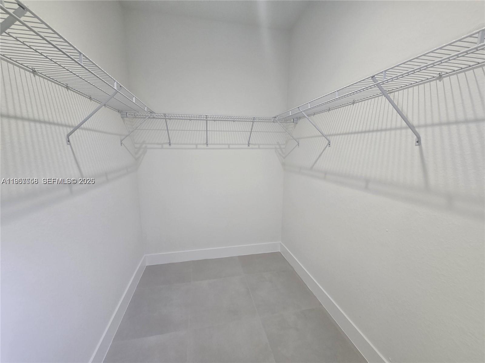 19534 Southwest 324th Street Homestead, FL 33030 - Photo 18 of 86 a view of a room with racks on the wall