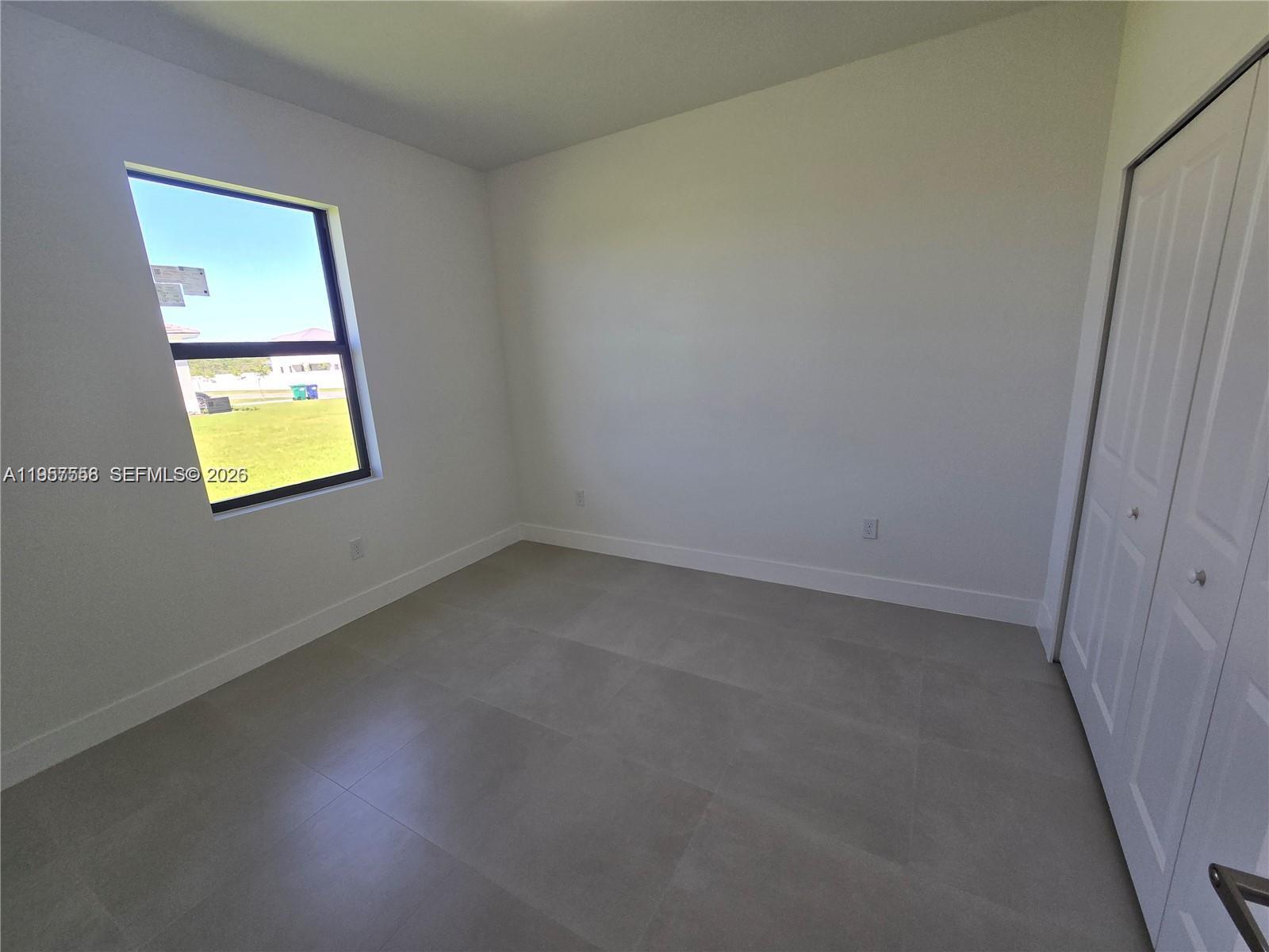 19534 Southwest 324th Street Homestead, FL 33030 - Photo 23 of 86 an empty room with a window