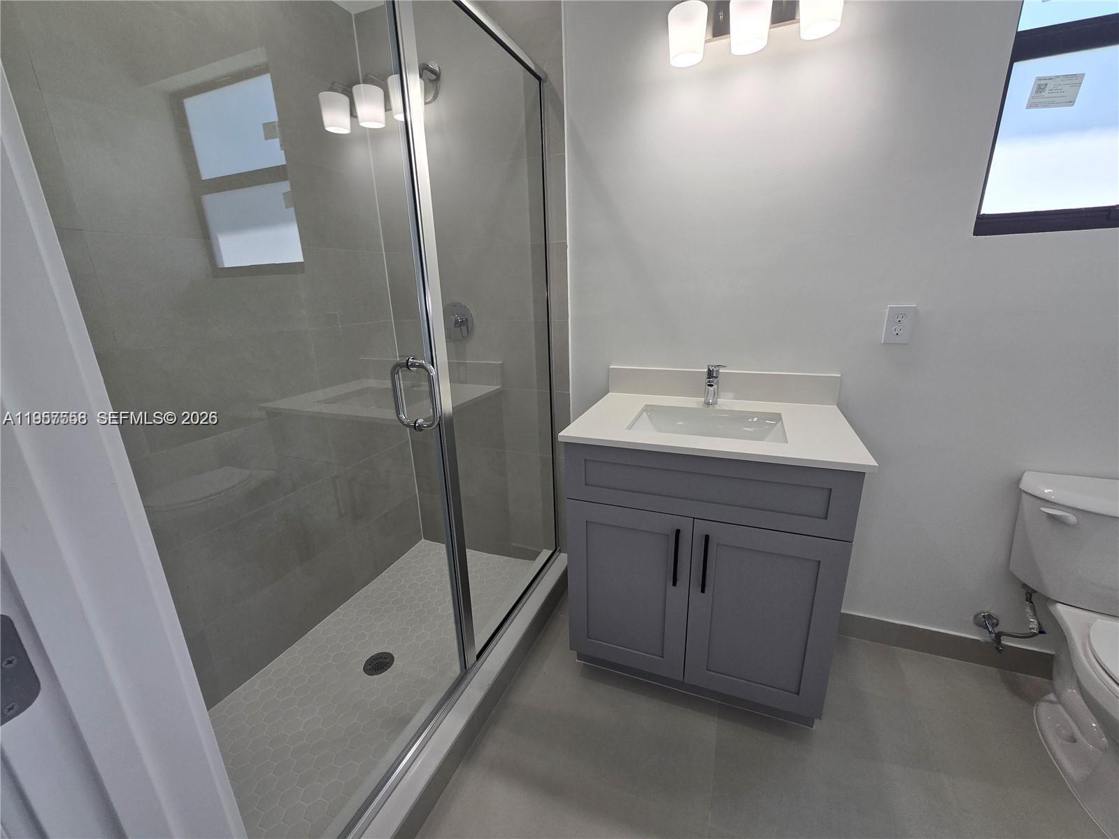 19534 Southwest 324th Street Homestead, FL 33030 - Photo 36 of 86 a bathroom with a sink a toilet and shower