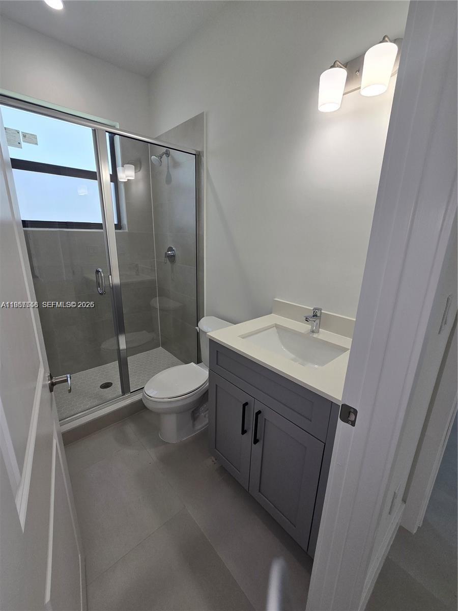 19534 Southwest 324th Street Homestead, FL 33030 - Photo 62 of 86 a bathroom with a sink a toilet and shower