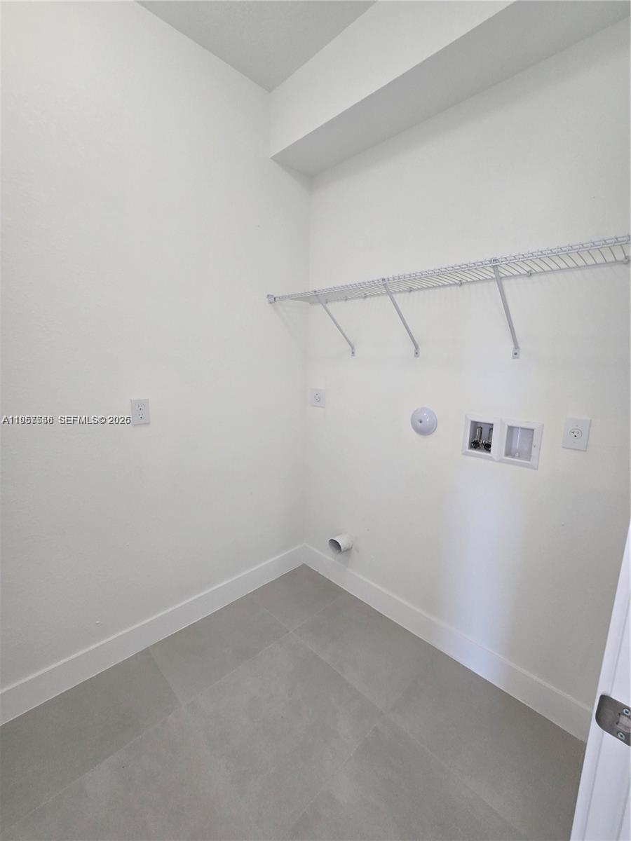 19534 Southwest 324th Street Homestead, FL 33030 - Photo 70 of 86 a view of a room with racks on the wall