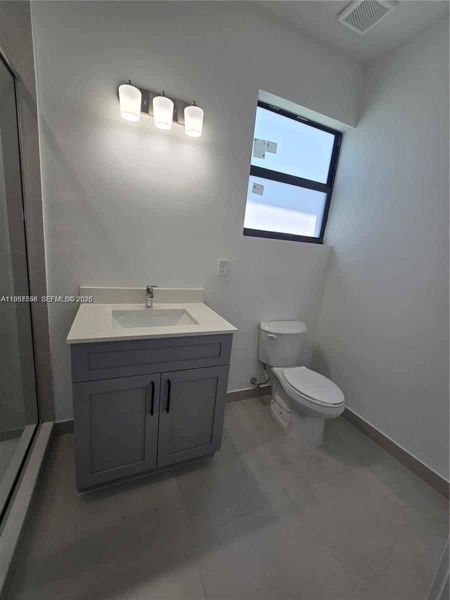 19534 Southwest 324th Street Homestead, FL 33030 - Photo 74 of 86 a bathroom with a sink and a toilet