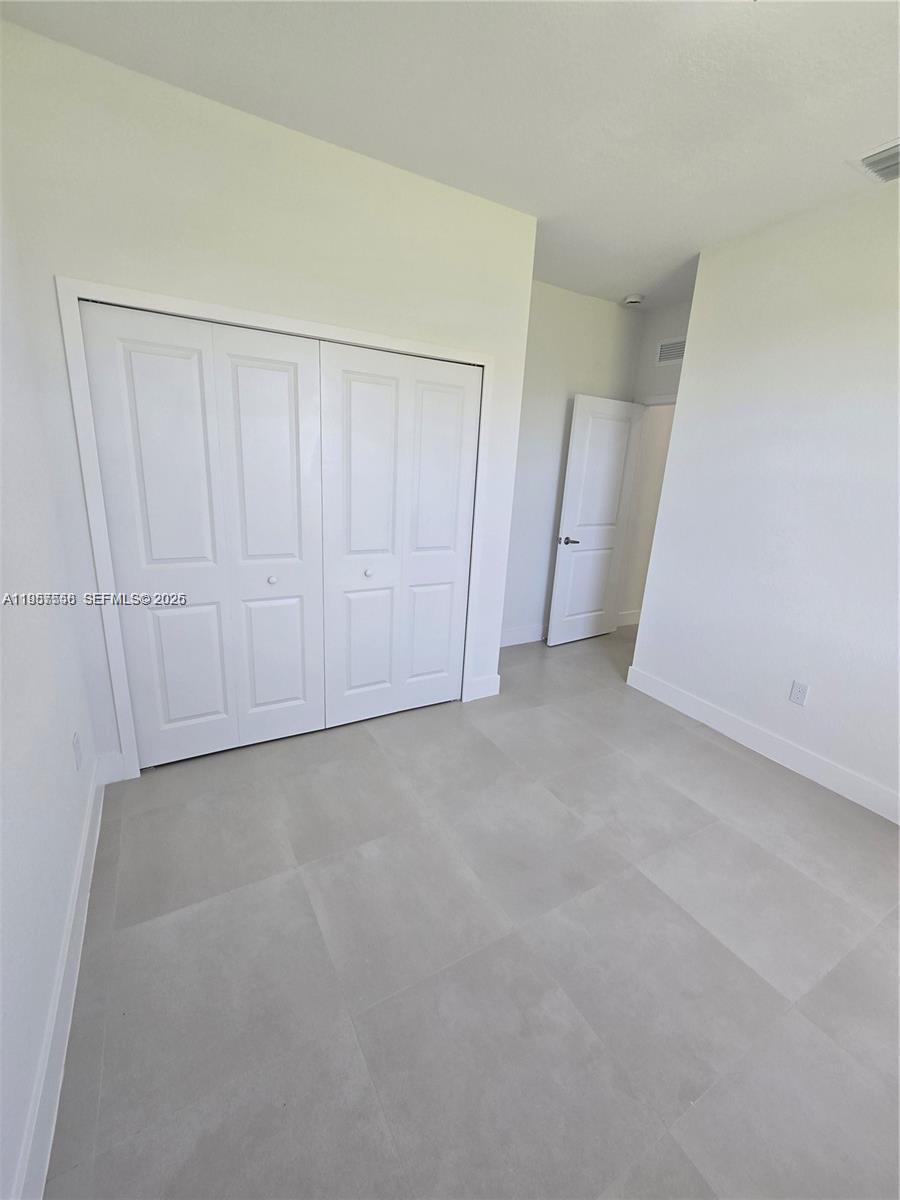 19534 Southwest 324th Street Homestead, FL 33030 - Photo 76 of 86 an empty room with a empty space