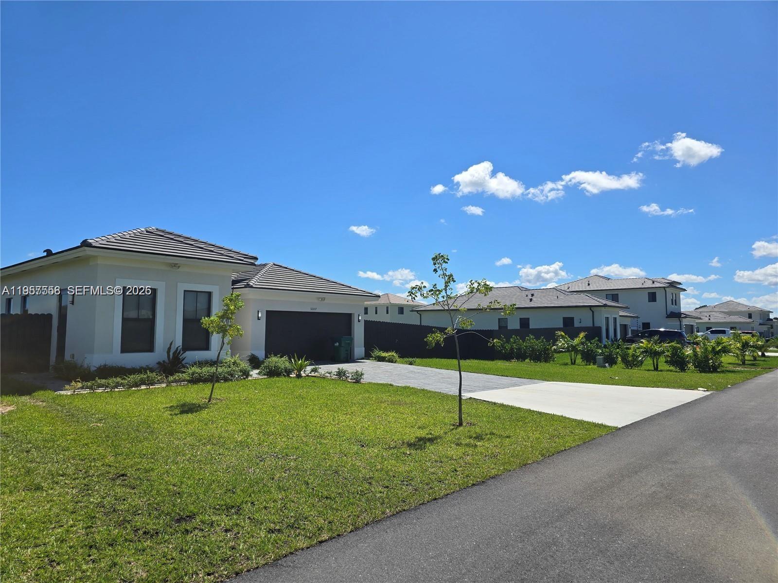19534 Southwest 324th Street Homestead, FL 33030 - Photo 81 of 86 a view of a house with backyard and porch
