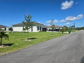 19534 Southwest 324th Street Homestead, FL 33030 - Photo 86 of 86 a view of a house with a big yard and potted plants