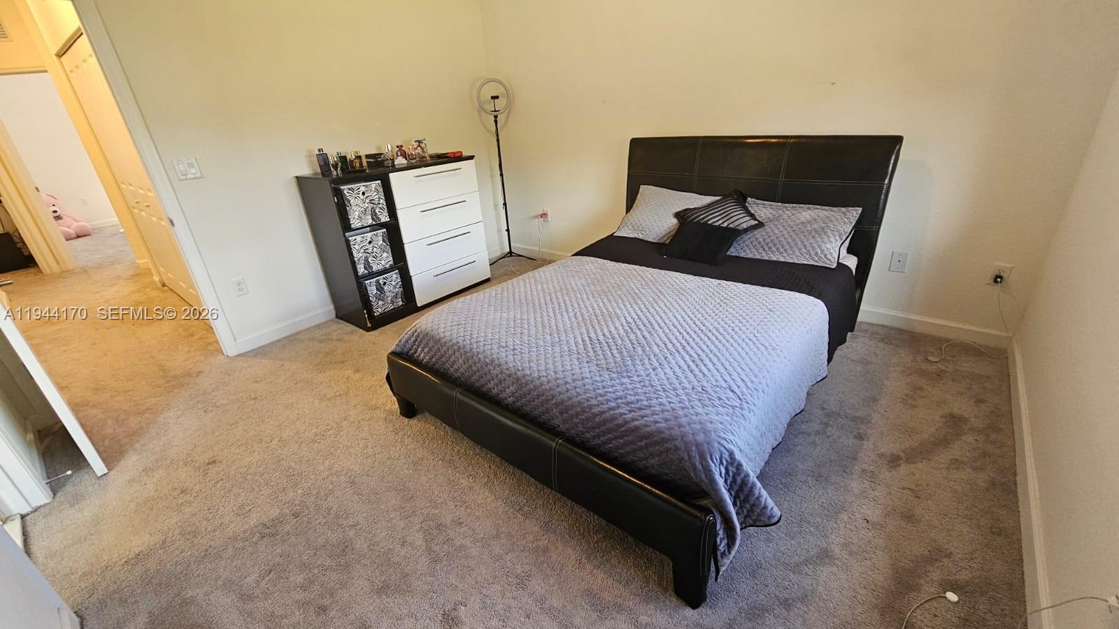 1146 Southeast 26th Street Homestead, FL 33035 - Photo 17 of 42 a bedroom with bed and window