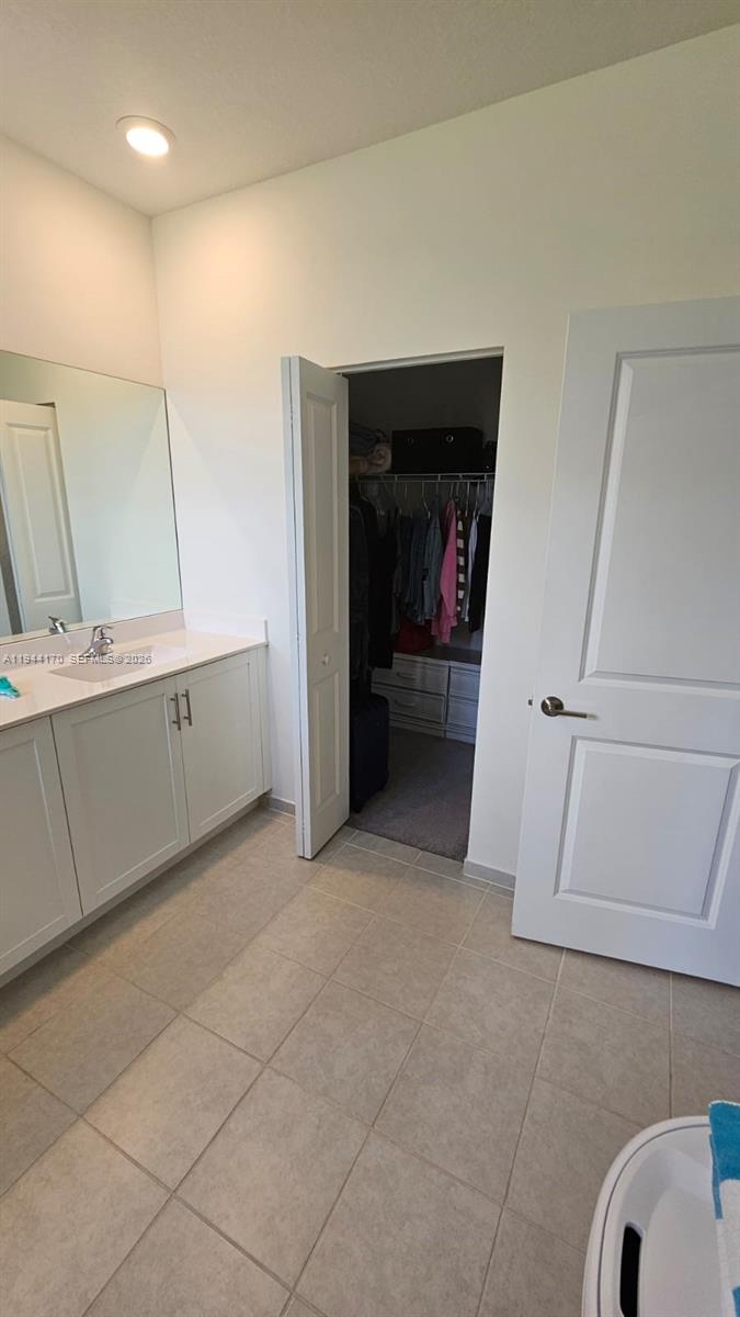 1146 Southeast 26th Street Homestead, FL 33035 - Photo 19 of 42 a view of a kitchen cabinets and a car garage