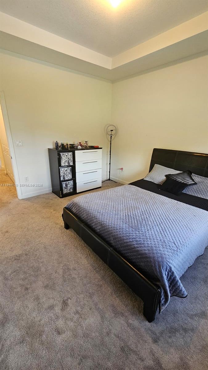 1146 Southeast 26th Street Homestead, FL 33035 - Photo 20 of 42 a bedroom with a bed and a cabinets