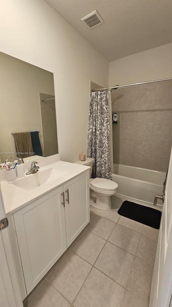 1146 Southeast 26th Street Homestead, FL 33035 - Photo 24 of 42 a bathroom with a sink a toilet and shower