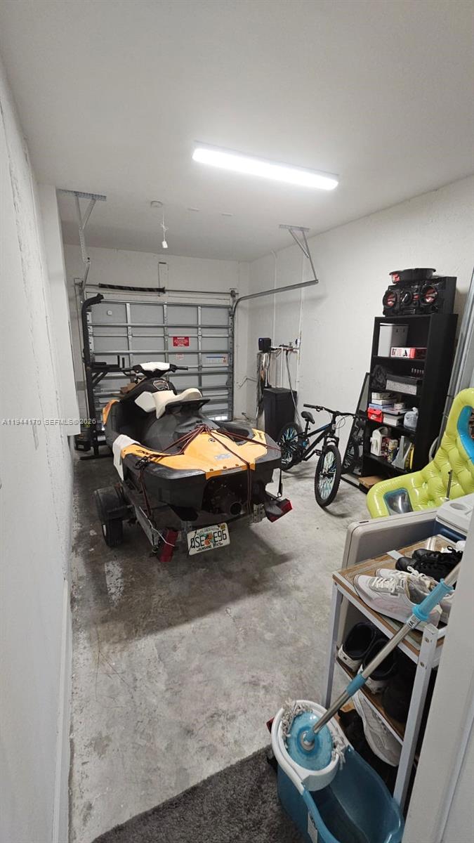 1146 Southeast 26th Street Homestead, FL 33035 - Photo 31 of 42 a room with gym equipment and lots of equipment