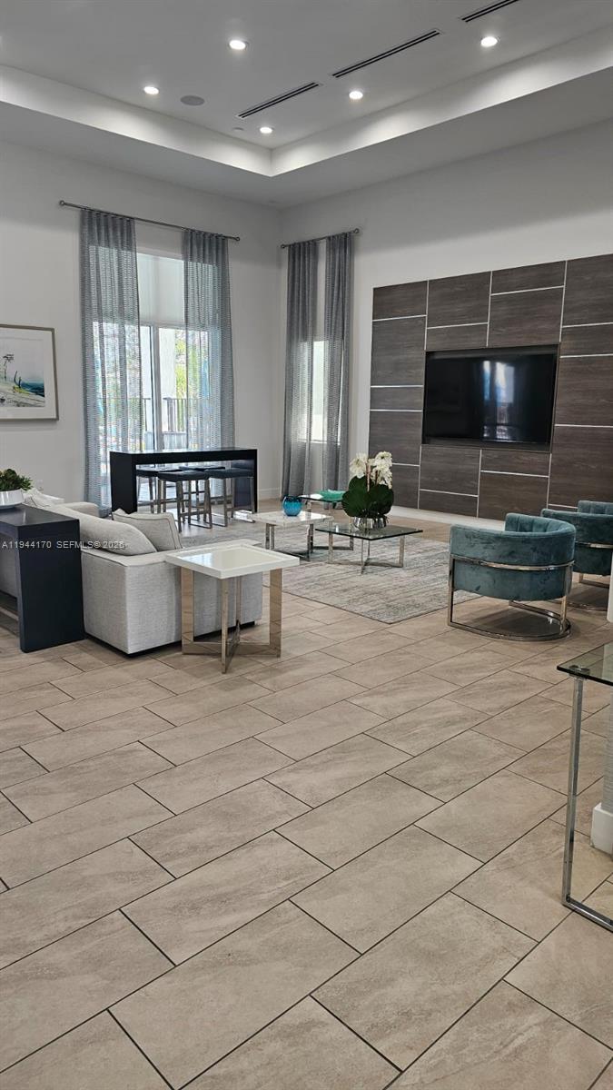 1146 Southeast 26th Street Homestead, FL 33035 - Photo 34 of 42 a living room with furniture and a flat screen tv