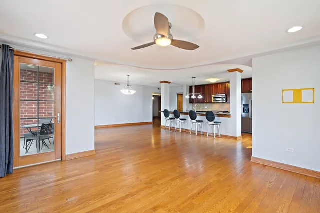 a view of kitchen and dining room with wooden floor