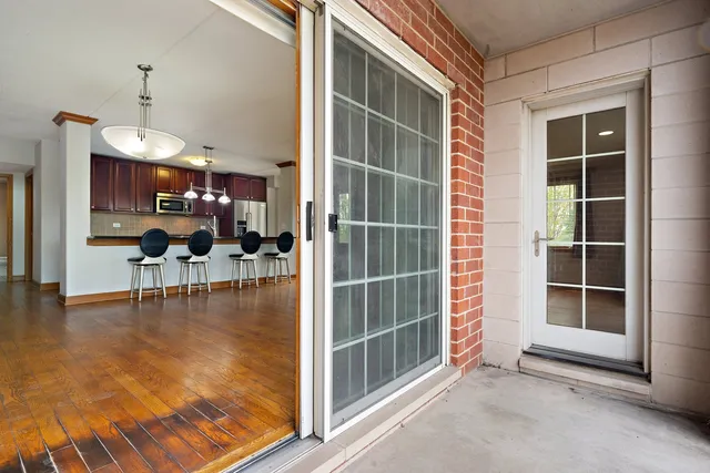 a view of a living room and livingroom with furniture wooden floor and a fireplace