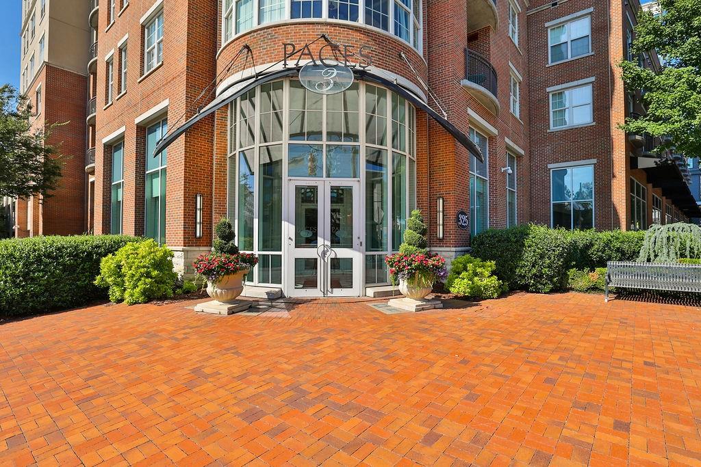 325 East Paces Ferry Road Northeast, Unit 1705 Atlanta, GA 30305 - Photo 1 of 1 a view of a building with sitting area