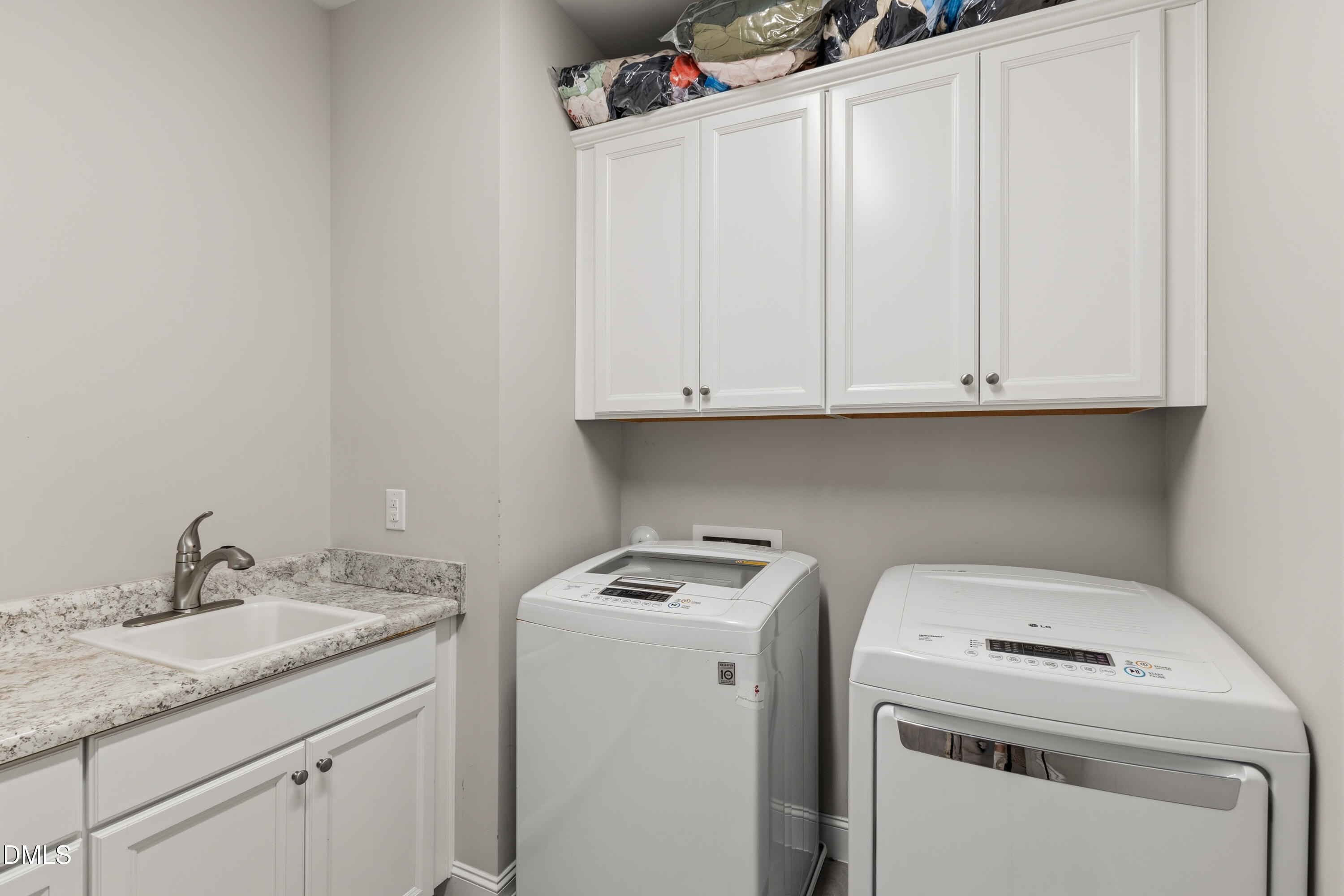 7421 Stonehenge Farm Lane Raleigh, NC 27613 - Photo 28 of 48 a utility room with dryer and washer