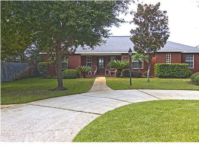 3927 Mesa Road Destin, FL 32541 - Photo 1 of 16 a view of a house with a yard