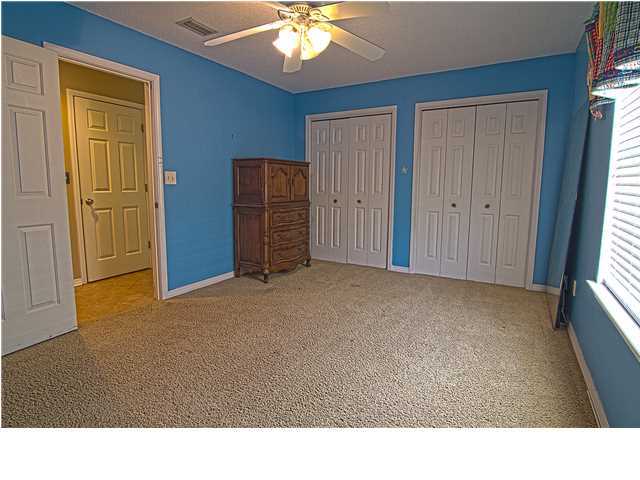 3927 Mesa Road Destin, FL 32541 - Photo 11 of 16 a living room with furniture and a chandelier