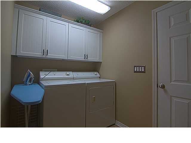 3927 Mesa Road Destin, FL 32541 - Photo 12 of 16 a kitchen with a sink and cabinets