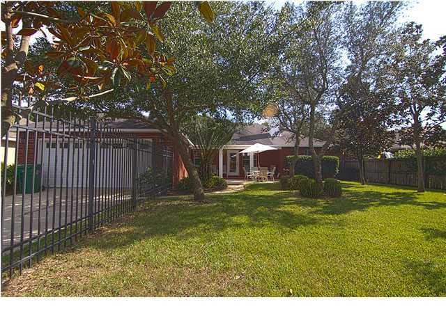 3927 Mesa Road Destin, FL 32541 - Photo 14 of 16 a view of backyard of house with green space