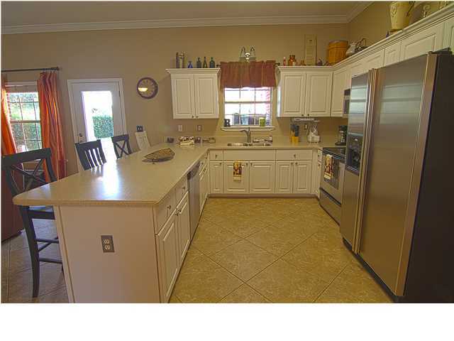 3927 Mesa Road Destin, FL 32541 - Photo 4 of 16 a kitchen with a sink refrigerator and window