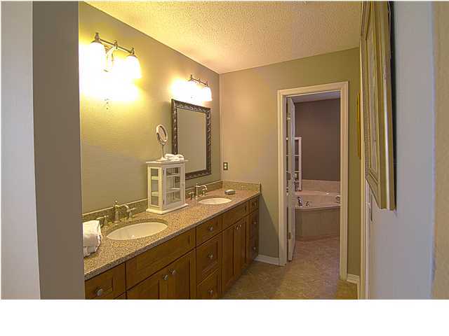 3927 Mesa Road Destin, FL 32541 - Photo 8 of 16 a bathroom with a sink vanity granite and a mirror