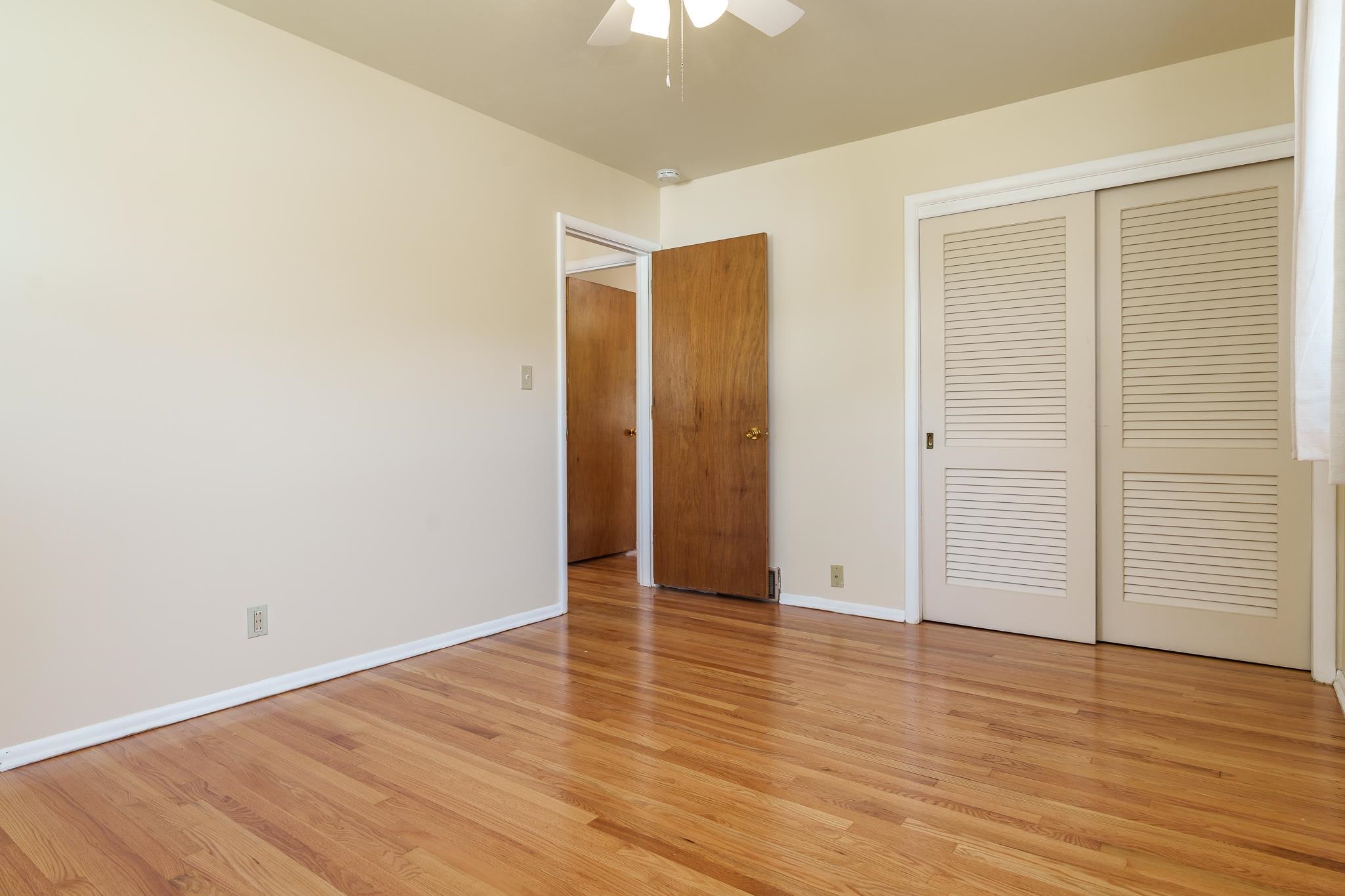 3332 Wesleyan Avenue Rockford, IL 61108 - Photo 13 of 45 an empty room with wooden floor and door