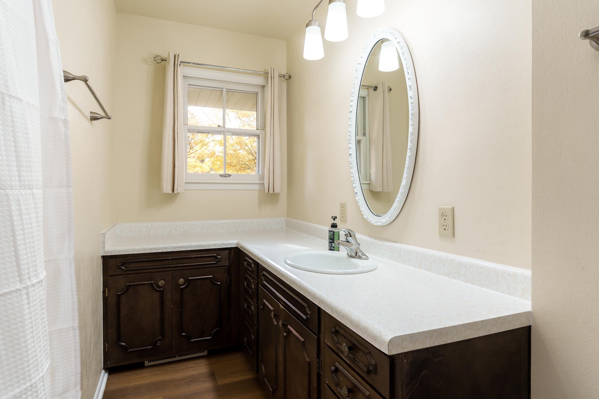 3332 Wesleyan Avenue Rockford, IL 61108 - Photo 17 of 45 a bathroom with a sink and a mirror
