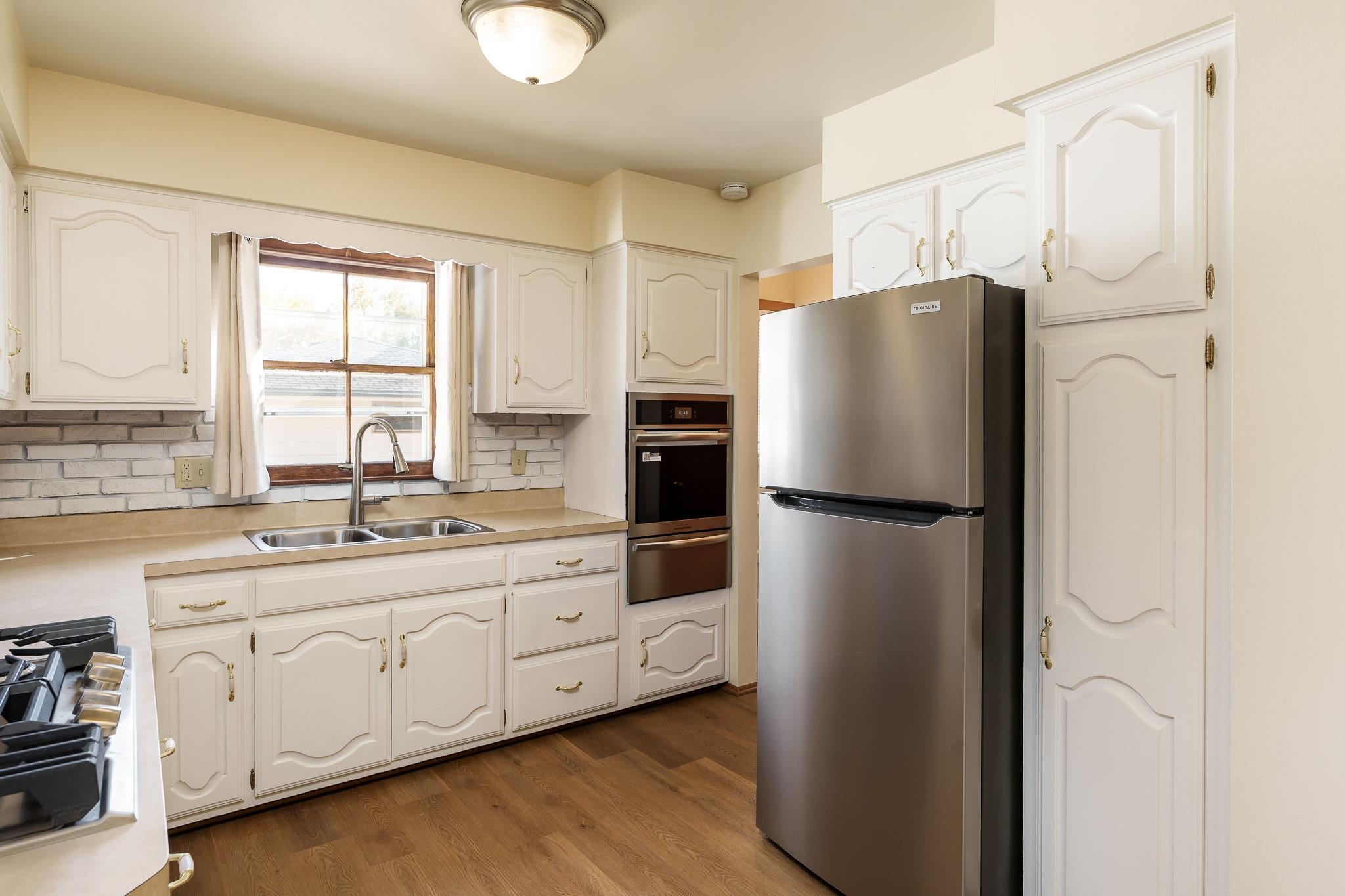 3332 Wesleyan Avenue Rockford, IL 61108 - Photo 20 of 45 a kitchen with stainless steel appliances a refrigerator sink and cabinets